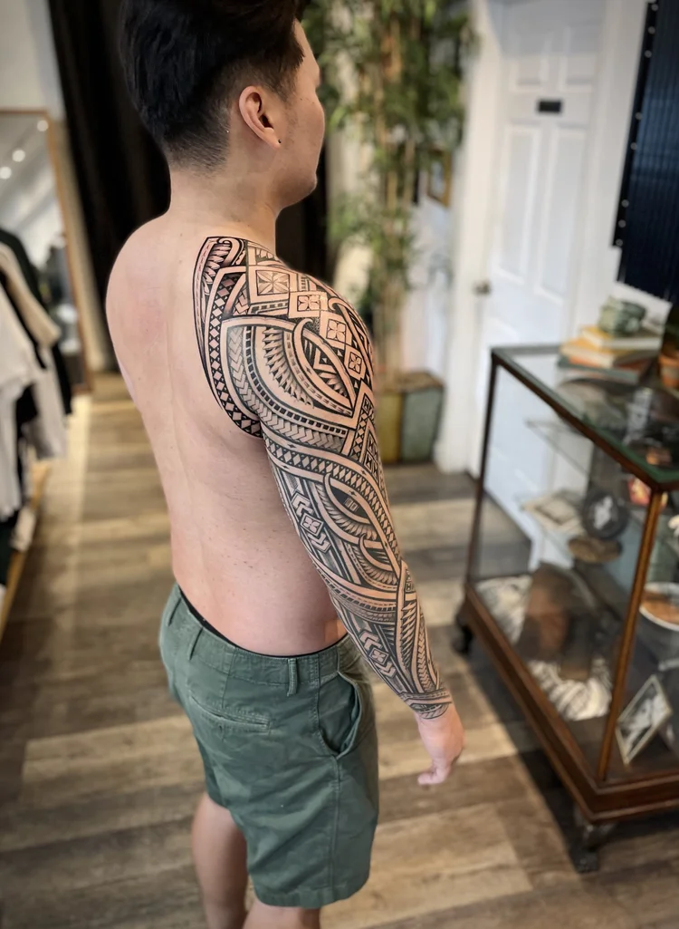 Polynesian tribal full-sleeve tattoo of Niho Mano symbols | Downtown Las Vegas
