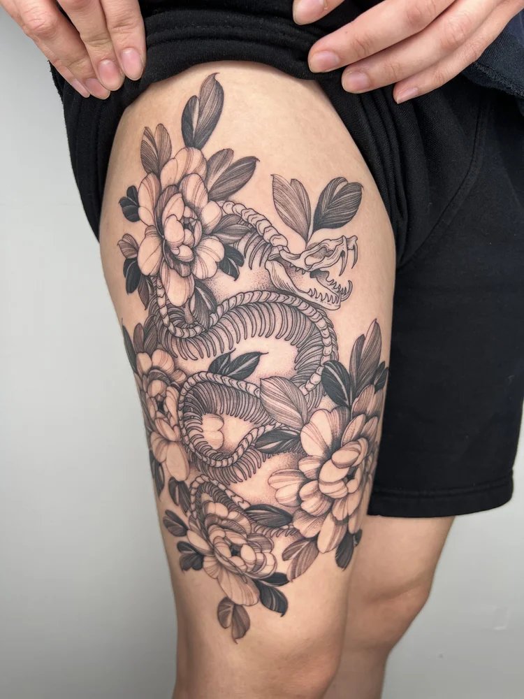 Black and grey illustrative thigh tattoo of snake | Downtown Las Vegas