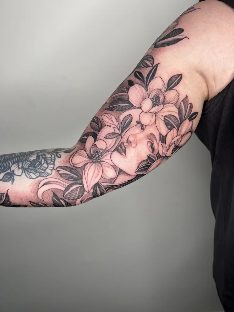 Illustrative tattoo sleeve of woman’s face | Las Vegas Arts District