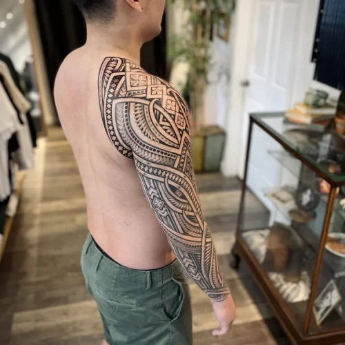 Polynesian tribal full-sleeve tattoo of Niho Mano symbols | Downtown Las Vegas