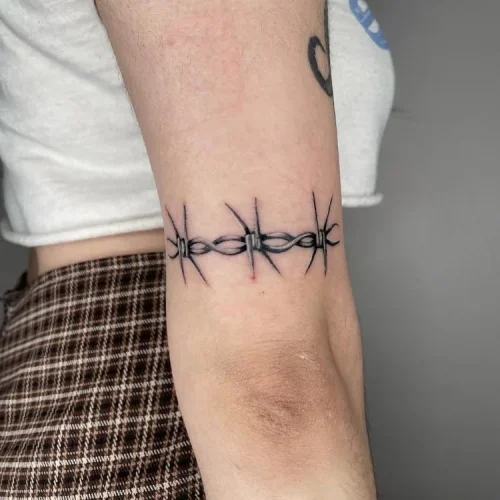 Bold black and grey barbed wire armband tattoo | Las Vegas Arts District