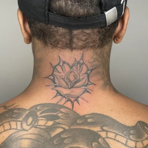Black and grey rose tattoo surrounded by a thorny heart | Downtown Las Vegas