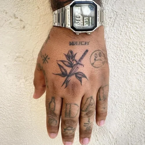 black and grey rose tattoo on hand Las Vegas - By Marcos 18b Tattoo
