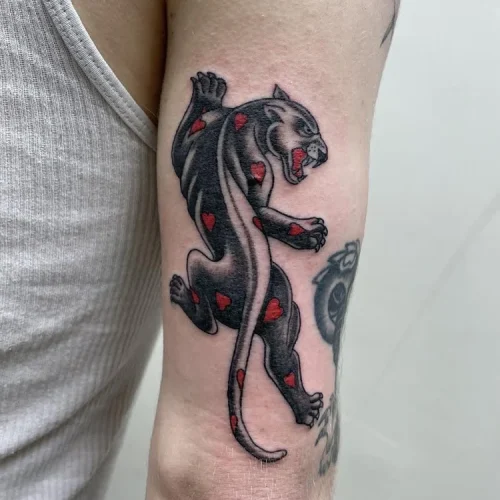 panther tattoo with red heart patterns | Downtown Las Vegas