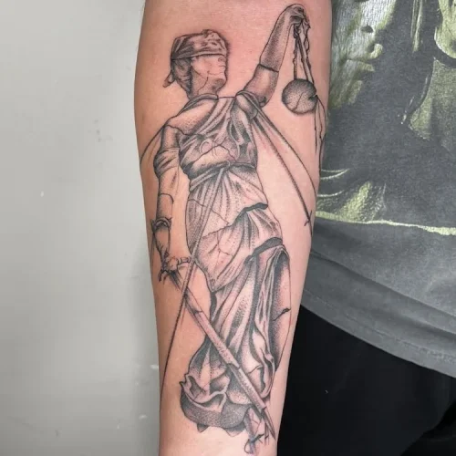 fine-line forearm tattoo of a Lady Justice- By Marcos Ta 18b Tattoo