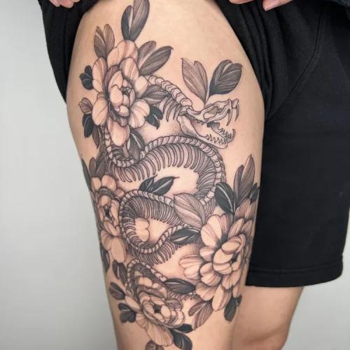 Black and grey illustrative thigh tattoo of snake | Downtown Las Vegas