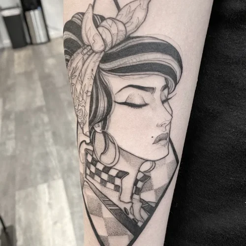 Illustrative tattoo of a pin-up style woman - By Tyson 18b Tattoo
