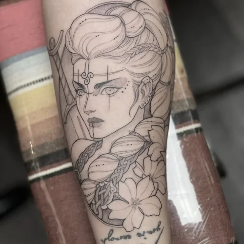 Fine-line black and grey tattoo of a Viking maiden | Las Vegas Arts District