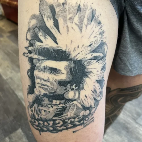 black and grey tattoo of an Indigenous leader - By Tyson 18b Tattoo