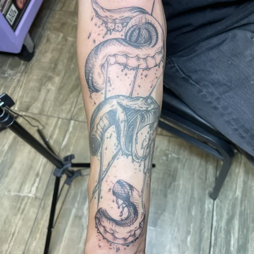 black and grey snake tattoo on inner bicep Vegas - By Baby G 18b Tattoo