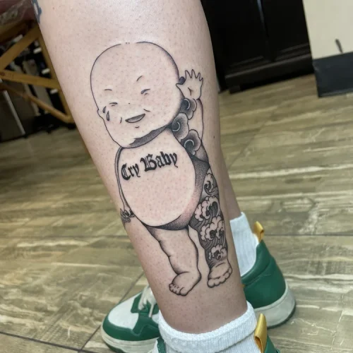Kewpie doll tattoo with Japanese-style wave patterns | Downtown Las Vegas